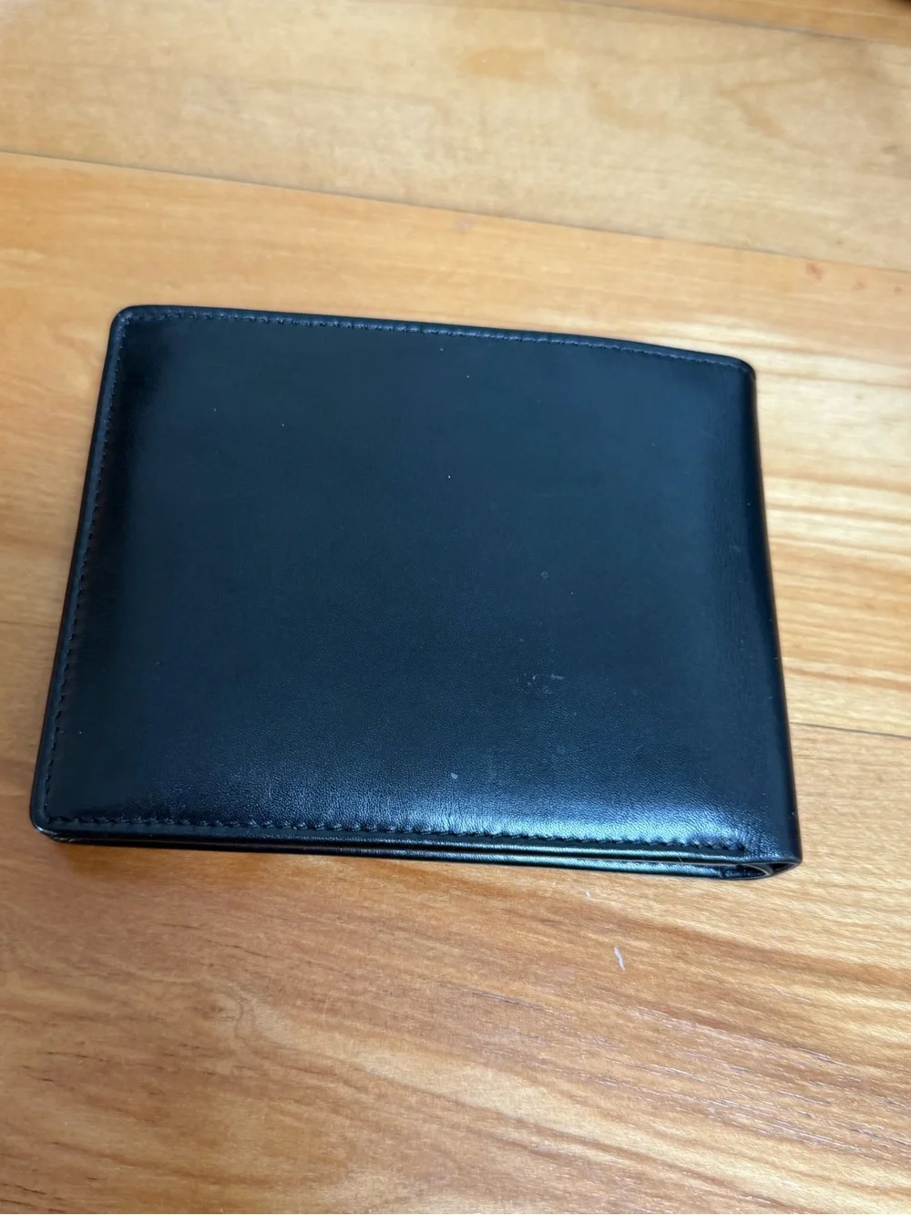 Polo Ralph Lauren bi-fold leather wallet in black featuring a debossed logo